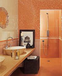 Orange and gray boy's bathroom features top half of walls painted bright orange and bottom half of walls clad in white staggered tiles lined with a kohler brockway sink fitted with two gooseneck faucets and a white beveled mirror lit by cage sconces as well a pair of. Home Staging Tips Space Saving Small Bathrooms Design