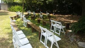 Trusted by 1000s of event facilities and rental companies for quality and service. White Folding Chairs With Rustic Benches At Ceremony Dpc Event Services Wedding Folding Chair Event Services Rustic Bench