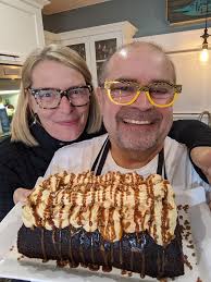 Sticky toffee pudding cake with sticky toffee buttercream 8 oz of pitted  dates 1 and 1/2 cups of boiling water 1 tsp of baking soda 1/2 cup of  butter 1 cup of