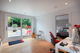 This garage conversion blends a home office and a small seating area complete with a couch for guests. Ideas For Garage Conversions That Create More Living Space And Increase The Resale Value Topsdecor Com
