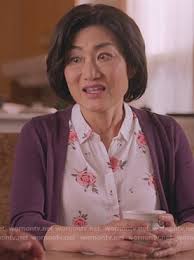 WornOnTV: Uma's white rose print sleeveless top