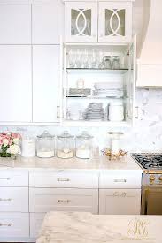 Organizing your kitchen cabinets will give you a tidier space; Spring Cleaning Dish Cabinet Organizing Tips Randi Garrett Design