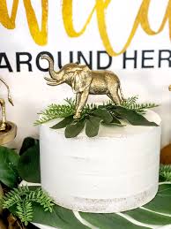 The watercolor prints bring a classic feel to the party and the fresh flowers/greenery help make the shower look more formal. Glam Safari Baby Shower Parties With A Cause