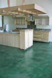 Stained concrete floors have become the perfect decorative concrete solution for interior floors because of its excellent value. Kemiko Concrete Floor Stain Application Photo Concrete Floors Flooring Concrete Floor Stain