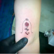 Photo of tattoo #disney #rose #castle. Tattoo Uploaded By Alyssa Beauty And The Beast Rose Beautyandthebeast Rosetattoo Beautyandthebeastrose Magicalrosetattoo Disney Disneyprincess Smalltattoo 1057411 Tattoodo