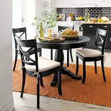 Windsor arm chair excellent kitchen wooden chair constructed from wood and finished in a nice dark brown stain. Vintner Black Wood Dining Chair And Cushion Crate And Barrel