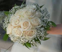 Official website of uaeflowers.com delivery anywhere in uae. Cream Roses With Babys Breath And Green Collar Flower Bouquet Wedding Bridesmaid Flowers White Wedding Bouquets