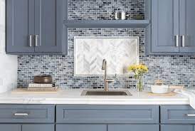 In white, the kitchen looks more appealing. Kitchen Trends For 2019 What S Current What To Avoid Mosaic Backsplash Kitchen Mosaic Tile Kitchen Backsplash Tile Design