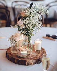 Rustic Themed Weddings Are Still Super Charming And Relaxed Rusticweddings Rusticcenterpiece B Unique Wedding Receptions Wedding Table Wedding Centerpieces