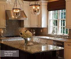 It all works together to create a thoroughly modern kitchen space. Off White Glazed Cabinets And Dark Kitchen Island Kitchen Craft Off White Kitchens Dark Kitchen Island White Glazed Cabinets