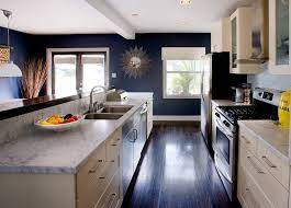 We figured we could always paint the island white down the road, and while we totally loved we built the kitchen platter racks last year to fill in the empty wall space. Dark Wood Kitchen Cabinets With Blue Walls Kitchen Ideas Photos Houzz