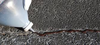 Liquid nails adhesive will reach its maximum strength within 7 days. How To Repair Asphalt Driveway Cracks Lowe S