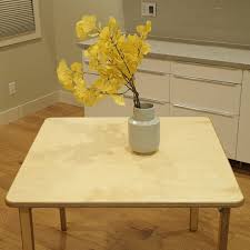 Attach folding leg brackets to the outfeed table underneath. How To Build An Easy Diy Folding Table Family Handyman