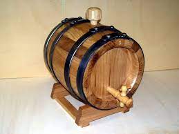 Solid wood banker's chair w/ leather seat back. Roll Out The Barrels