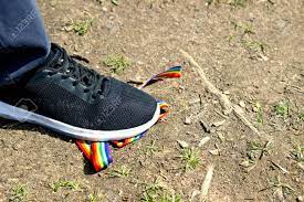 Trampling Of LGBT Flag In Dirt By Radical Homophobe. Rainbow LGBT Tape Is  Stamped With Feet. Stock Photo, Picture and Royalty Free Image. Image  148129113.