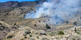 Crews battle wildfire near Basalite Mine