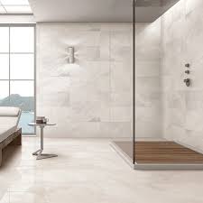 Once sealed with our mpg polished tile sealer the outstanding beauty of these tiles can be enjoyed with peace of mind that they will last the test of time. Pietra Ivory Porcelain Tiles 600x300mm Stone Tile Company Large Bathrooms Bathroom Wall Tile Porcelain Tile Bathroom