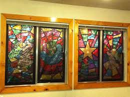 Christmas Mock Stained Glass Windows Using Cellophane Black Electrical Tape This Is My First Stained Glass Christmas Christmas Window Display Stained Glass