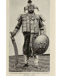 A professional Executioner from central India As you may see for yourselves, he is a man of most gigantic stature, and he is so rigged up as to inspire feelings of terror
