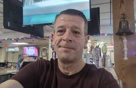 Bartender using phone at work