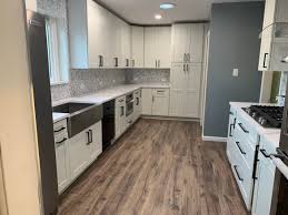Quality red tag floors, with locations in edmonton and calgary, shares some. New Kitchen With Bright Cabinets Laminate Floors