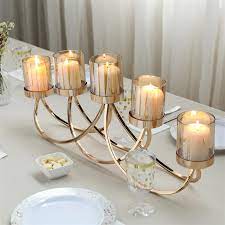 Perfect for bedroom mood lighting or a living room centerpiece, it also makes an excellent addition to event furnishings. 2ft Golden Metal Candle Holder 5 Arm Candelabra Centerpiece