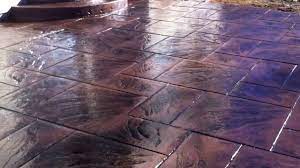 Stamped concrete has the ability to replicate stone, such as slate or cobblestone, brick, tile, and even wood. Stamped Concrete Colored Stamped Concrete Installation Youtube
