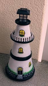 Pin By Doris Zapp On Bloempotten Clay Pot Lighthouse Painted Clay Pots Clay Pot Projects