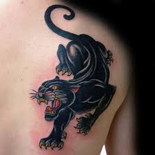 Back Of Shoulder Blade Mens Traditional Panther Tattoo Traditional Panther Tattoo Panther Tattoo Black Panther Tattoo This design indicates that the person is interesting and unique while at the. mens traditional panther tattoo