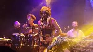 — is this her overcoat? Who Is This America Dem Speak Of Today Von Antibalas Laut De Song