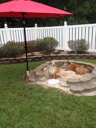 The streets can be an unsafe place for dogs unless they are accompanied by their owner. Diy Doggy Sandbox For Those Who Dig It Just Dig A Hole And Line It With Landscape Pavers And Cinderblocks Dog Friendly Backyard Dog Backyard Dog Playground