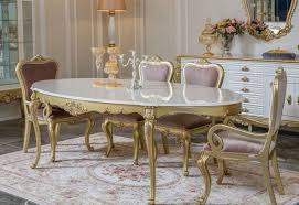 Aside from the gold dining table, the huge yellow flower on the wall looked very artistic as well as the furry chairs too! Casa Padrino Luxury Baroque Dining Room Set Pink White Gold 1 Oval Dining Table 6 Dining Chairs Magnificent Dining Room Furniture In Baroque Style