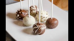 Sprinkle with the reserved cake crumbs then insert the sticks into a polystyrene block or similar to keep them upright. How To Make Cake Pops Red Velvet Youtube