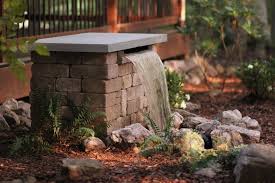 An inch or two is common. Build A Stone Waterfall Fountain Hgtv