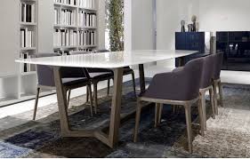 It's a gathering place for friends and family to share jokes and stories over a delicious meal or a. Purple Dining Room Chairs Dining Room Dining Table Marble Marble Top Dining Table Modern Dining Room