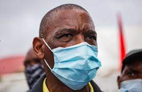 Ace magashule waving at scores of his supporters moments after appearing at the bloemfontein magistrate's court. Oijzzknpkrfptm