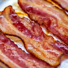 The salted and smoked meat from the back and sides of a pig. The Easiest Oven Baked Bacon Recipe Scrambled Chefs