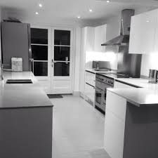 Maybe you would like to learn more about one of these? White Gloss Units French Doors And Grey Corian Worktops With Painted Grey Floorboards Our New Kitchen Is Finis Grey Floorboards Corian Worktops White Kitchen