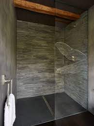 Bathroom shower designed with black slate tiles and built in bench. A Shower With Black And Grey Slate Slate Shower Bathroom Shower Walls Slate Shower Walls