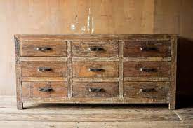 Create an inviting and functional bedroom retreat with this dresser featuring reclaimed pine with a corsican grey finish accented with brass. 9 Drawer Rustic Reclaimed Wood Dresser Rustic Dresser Reclaimed Wood Dresser Wooden Dresser