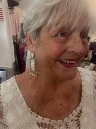 2 daughters brought their mom in for a new outfit to wear to dinner tonite-  I think she looks stunning in her new tops and pants and earrings- but what  brought me