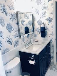Hale Navy Vanity Thibault Fan Coral Wallpaper In Navy Blue Blue Bathroom Coral Wallpaper Blue Powder Rooms