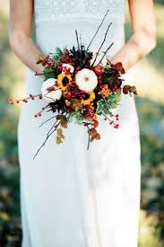 Fall wedding bouquets that feature leaves are really beautiful and highlight the season perfectly. Autumn Wedding Bouquet I Like The Small Sunflowers Fall Wedding Bouquets Fall Wedding Flowers Fall Bouquets