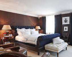 Taking Center Stage In A Classic Masculine Bedroom Is A Luxurious Navy Velvet U Masculine Interior Design Interior Design Bedroom Beautiful Bedroom Inspiration