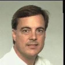 How does evolution compress genetic information into fewer chromosomes?