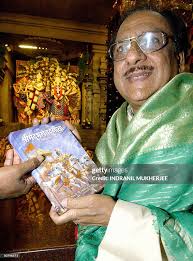 Pakistani Gazal singer Gulam Ali displays a copy of the Srimad... News  Photo