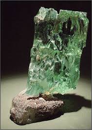 The Large And Ever So Clean Green Beryl Crystal From The Smithsonian Institute Gives One A Closer View O Crystals Minerals Minerals And Gemstones Mineral Stone
