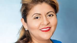 Erin Caputo of ROEM Corporation is a 2016 Woman of Influence