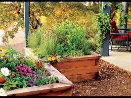 Using different sizes of galvanized tubs is a clever way to make a tiered herb garden. Raised Box Herb Garden Sunset Magazine