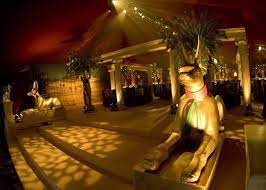 What better way to command respect at a party than by making a grand entrance as cleopatra and a pharaoh. Egyptian Party Egyptian Theme Decor Instead Of The Statues Could Have Really Big Vasses Egyptian Party Egyptian Themed Party Egyptian Prom